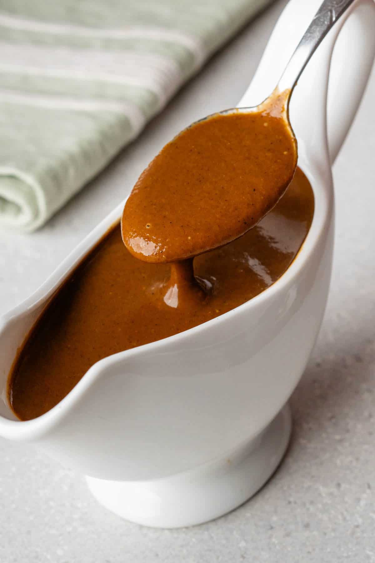 Spoon of vegan gravy to show texture